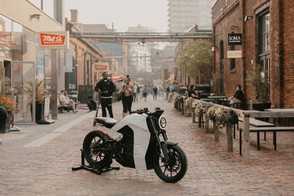 A motorcycle parked on a brick street